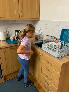 Youngest washes up!